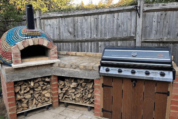 A pizza oven that has been customised using bottle tops by customer of Pizza Oven Supplies.